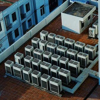 creative-approach-img High angle view of rooftop HVAC units on a building in Buon Ma Thuot, Vietnam.